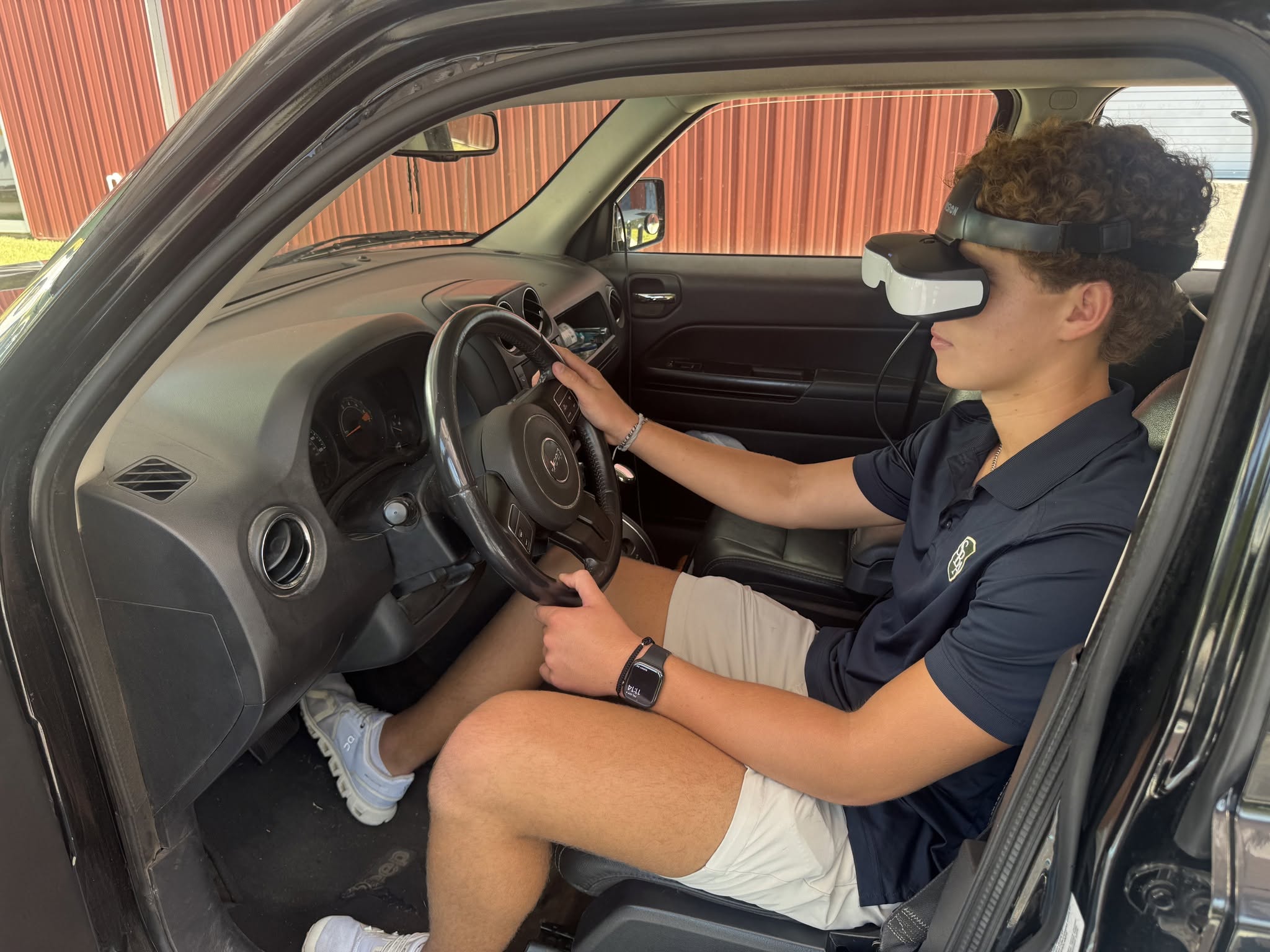person using a driving simulator